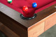 Close-up of Doc & Holliday Billiards Santorini Slate Pool Table showing genuine leather drop pocket with red Championship felt play surface Close-up of Doc & Holliday Billiards Santorini Slate Pool Table showing genuine leather drop pocket with red Championship felt play surface